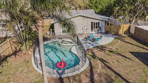 Private backyard oasis featuring a sparkling pool, spa, and spacious outdoor area to relax and unwind.
