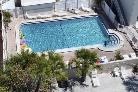 Access to a heated pool next door—perfect for a refreshing break after a day in the sun.
