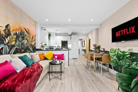 Living room with open plan kitchen and dining area