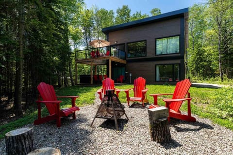Gather around the fire pit surrounded by peaceful woodland views.