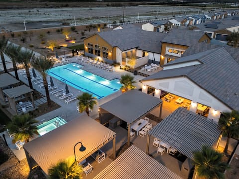 An aerial view of the expansive pool deck, cabanas, and social lounges.
