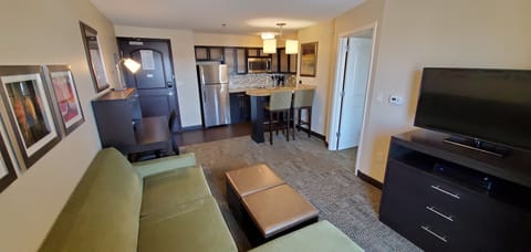 Premium bedding, desk, laptop workspace, blackout drapes