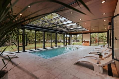 Slip into serenity with panoramic garden views from the pool.