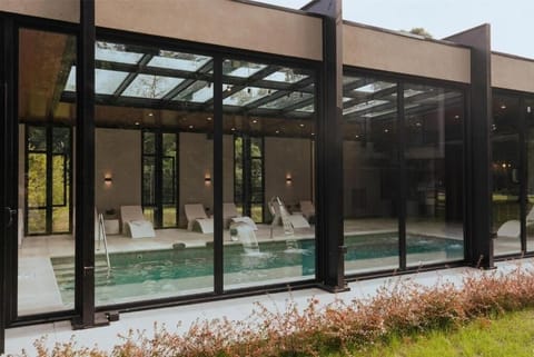 Step outside for fresh air, then return to warm indoor swimming.