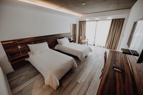 Stretch out in a spacious twin room with sleek finishes.