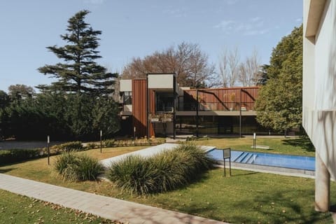 Lounge in style with modern lines and pool views.