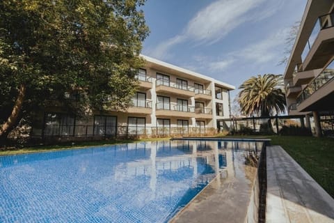 Unwind poolside with calming water views and sunshine.