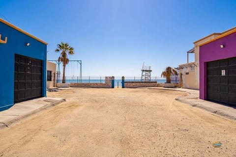 This 2-bedroom, 2-bath condo is just steps from the beach and 2 blocks from the Malecon — open floor plan, full kitchen, BBQ patio, and garage with outdoor shower