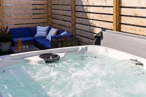 Relax in the hot tub in your own private oasis, surrounded by a cozy, secluded outdoor space. Perfect for unwinding after a long day and enjoying a peaceful, spa-like experience at home.