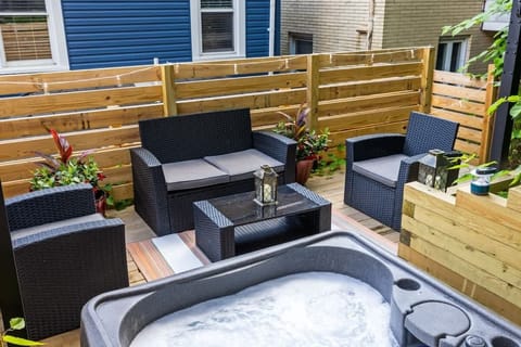 Soak and relax in your private hot tub, surrounded by comfortable outdoor seating—perfect for unwinding after a long day or enjoying a peaceful evening under the lights.