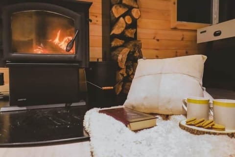 The indoor wood fireplace will envelop you with a sense of comfort