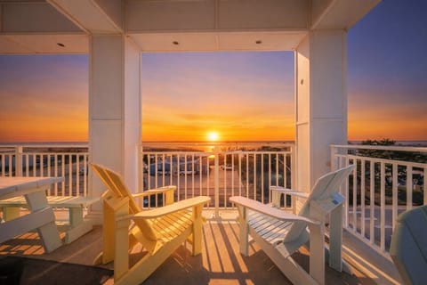 Unwind with stunning sunset views from your private balcony—warm coastal light and ocean breezes create the perfect evening setting.