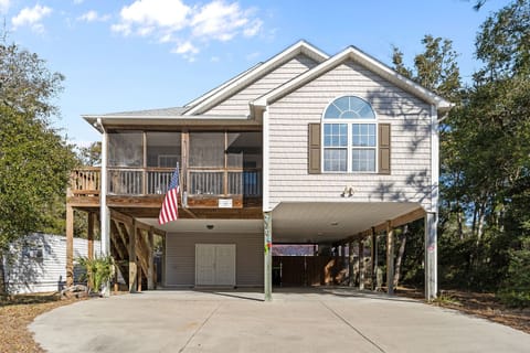 "Front view of pet‑friendly Oak Island rental with covered parking"