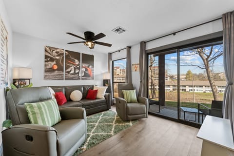 Bright, open living space with golf and water views