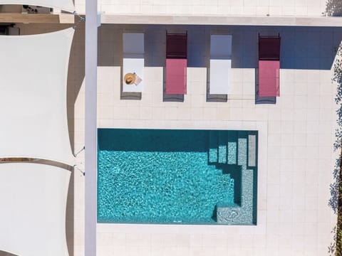 Outdoor pool, a heated pool, open open 24 hours, pool umbrellas