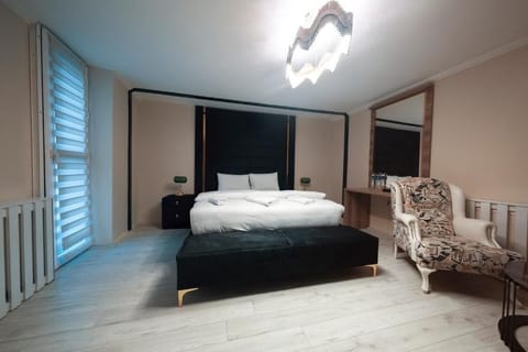 Deluxe Suite, City View | In-room safe, iron/ironing board, free WiFi, bed sheets