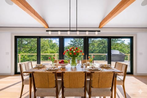 The bright second-floor living space is the heart of the home - perfect for gathering, relaxing, and taking in the views.
