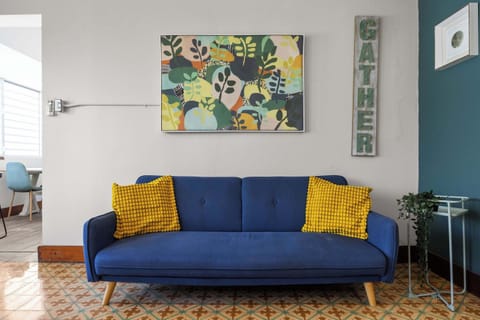 Blue sofa and wall decor