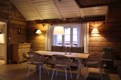 The living room with the original timber walls