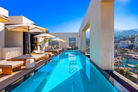 Unwind in our stunning rooftop infinity pool. Enjoy comfortable loungers and breathtaking panoramic views of the ocean.