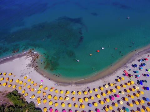 Private beach, white sand, beach umbrellas