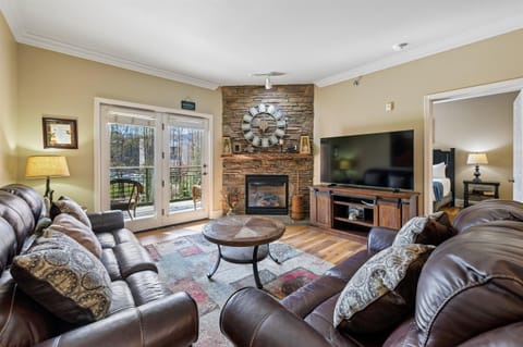 Sink into plush leather seating by your crackling fireplace, while natural light streams through French doors to your private balcony.