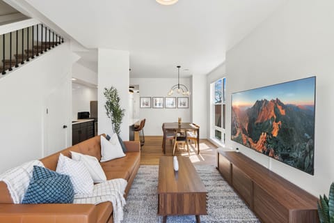 Open concept living room and dining room with lots of bright and airy Windows!