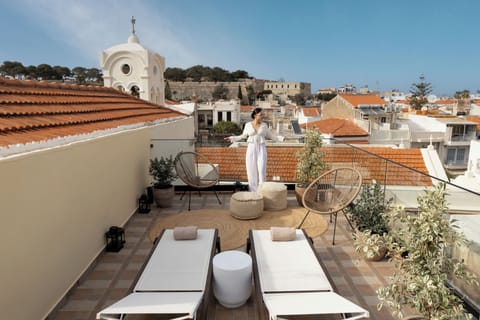 Elevated old town living with rooftop views and curated interiors.
