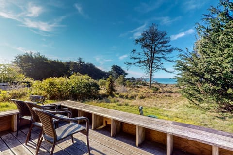 Savor your morning coffee on the spacious deck, where breathtaking ocean views and coastal breezes set the perfect backdrop for relaxation.