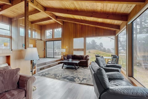Bask in the warmth of the gas fireplace as you soak in panoramic ocean views from the spacious living room, your perfect retreat after a day of exploration.