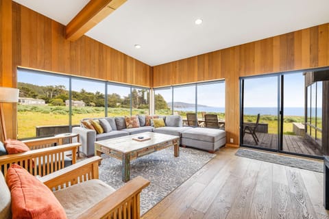 Picture yourself lounging on the plush sectional, soaking in the stunning views while the waves serenade you in the background.