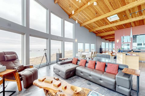 The soaring ceilings and spacious layout make this living room an ideal setting for family fun or relaxing with a good book.