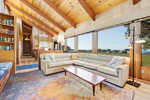 Morning light floods this inviting living room, where you can gather with your loved ones and enjoy stunning ocean views.