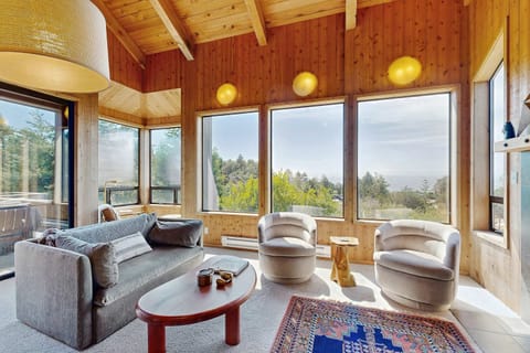 Bask in the natural light and stunning ocean views as you unwind in this inviting living space, perfect for family gatherings.