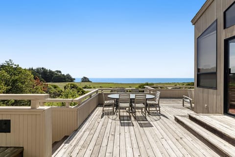 Embrace relaxation in your private hot tub on the deck, surrounded by nature, making it a perfect spot to unwind after a day of adventure.