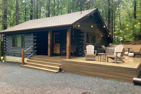 Step onto the inviting deck, where you can sip your morning coffee surrounded by towering redwoods and twinkling outdoor lights.
