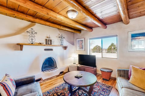 Warm your evenings by the classic kiva fireplace