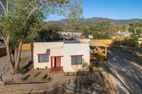 Settle into an authentic El Prado adobe with mountains on the horizon.