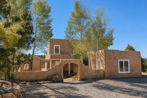 A charming adobe retreat, tucked away on 11 secluded acres.