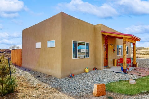 Arrive at your single-level adobe casa with a welcoming covered portal