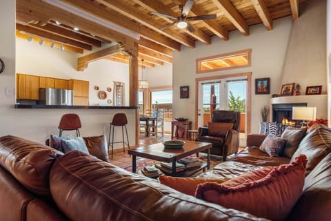 Relax in the open living room beneath vaulted viga ceilings