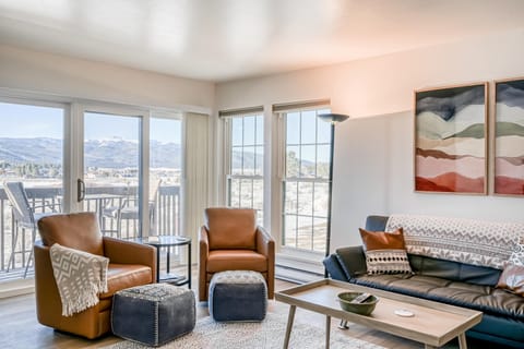 Relax in the bright living room with sweeping mountain and valley views