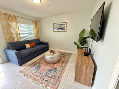 Stylish living room with smart TV and queen sleeper sofa for extra accommodations.