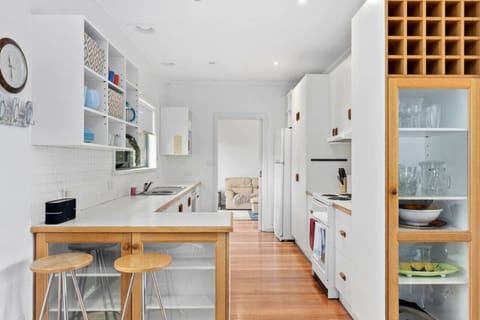 Cozy white kitchen, fully stocked for home cooking