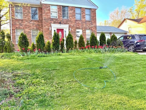 Front view of the house &two parking spots on the right side of the drive way.