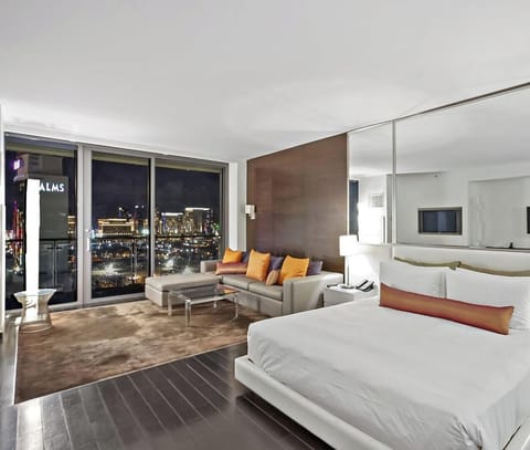 Spacious Bedroom and Lounge Area with a Strip View