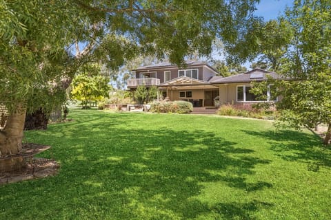 A garden entrance that sets the tone — lush, private, and full of character.