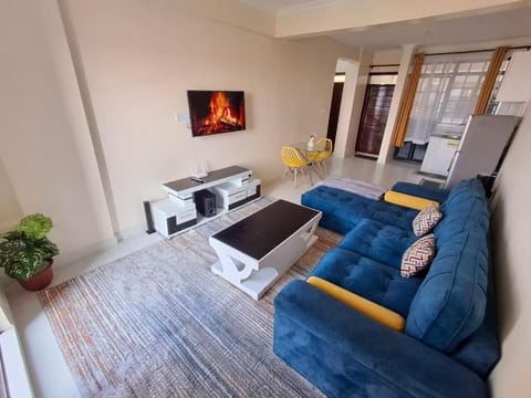 Deluxe Apartment | Living area | 32-inch Smart TV with digital channels