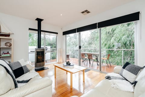 Cozy living room with a fireplace and balcony access