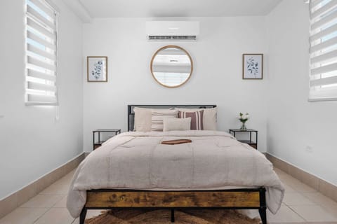 Serene, sun-drenched master bedroom